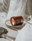 Bougie Hotel candle on a silver tray with a white background