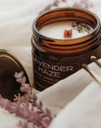 Candle labeled 'Lavender Haze' with lavender flowers around it