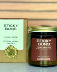 Sticky Buns candle and packaging with 'Gather by Flame' branding on a neutral background