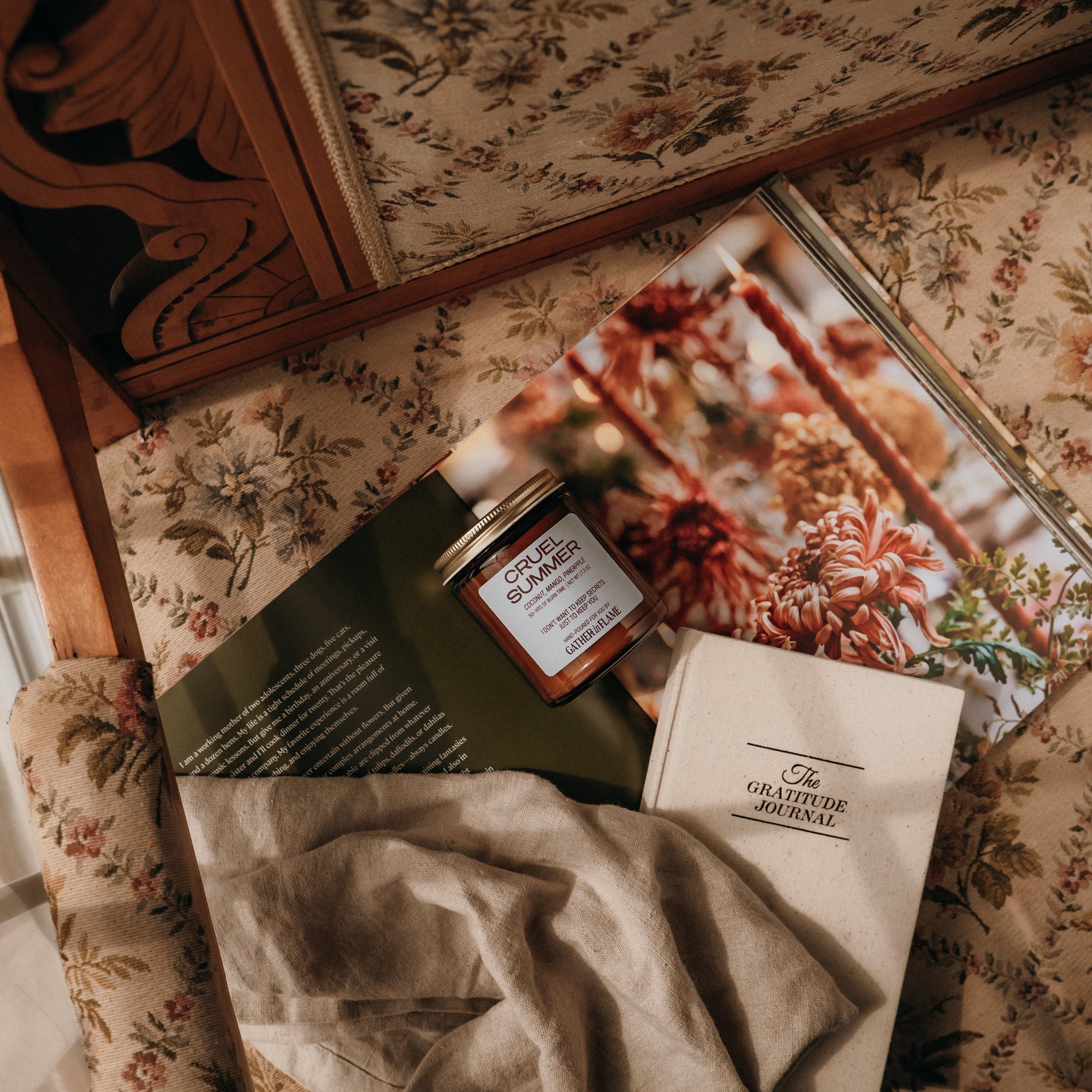 Product on a floral-patterned surface with a magazine underneath