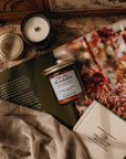 Cruel Summer product on a surface with a magazine and candle
