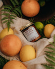 Jar of mango colada on a cloth with fruits and leaves